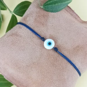 Bracelet mauvais œil : perle nazar blanche sur cordon bleu marine